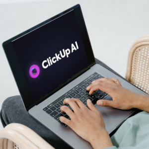 Laptop display with ClickUp AI logo on screen.
